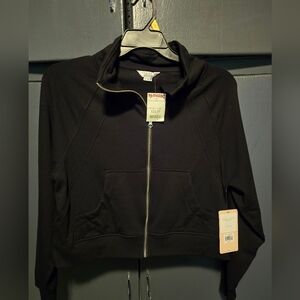 Nwt Danskin zip up jacket.  Has pockets, thumbholes. Stretchy. Size M. Black.